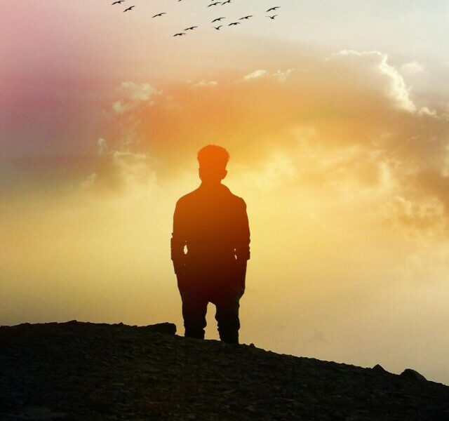 A man who looks towards the sky and tells his success story.